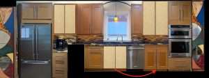 Modern kitchen with stainless steel fridge, double ovens, and a mosaic backsplash, centered by a sink under a window.